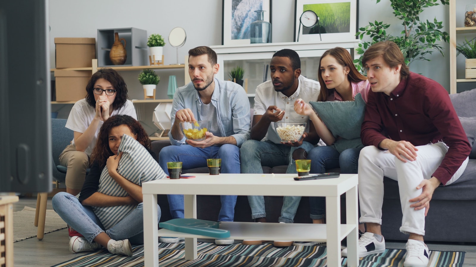 Family enjoying TV together at home